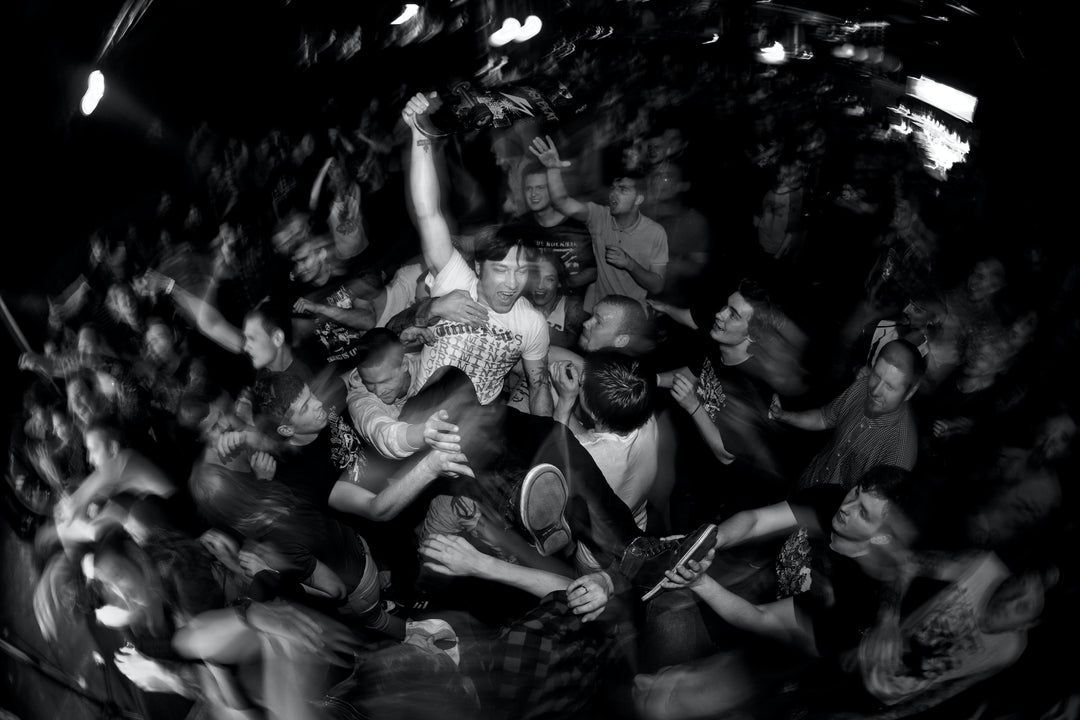 A Live Punk Rock Concert Performance At The Miner's Tavern In Cobalt Ontario Capturing The energy Of The Musicians On Stage The Lead Singer Captivating The Audience With Their Stage Presence & The Crowd Cheering Creating An Atmosphere Of Raw Spirit