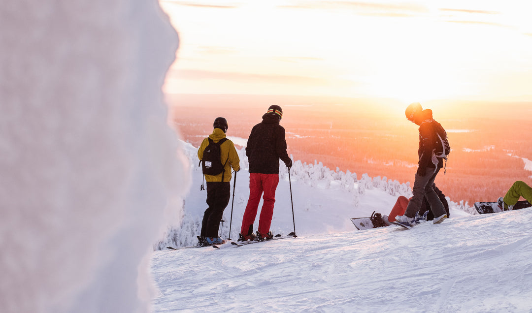 Skiers And Snowboarders Enjoying The Slopes At Tri-Town Ski & Snowboard Village In The Temiskaming Region Capturing The Exhilaration And Joy Of Winter Sports With The Mountain Landscape At Sunset Surrounded By Beautiful Winter Scenery