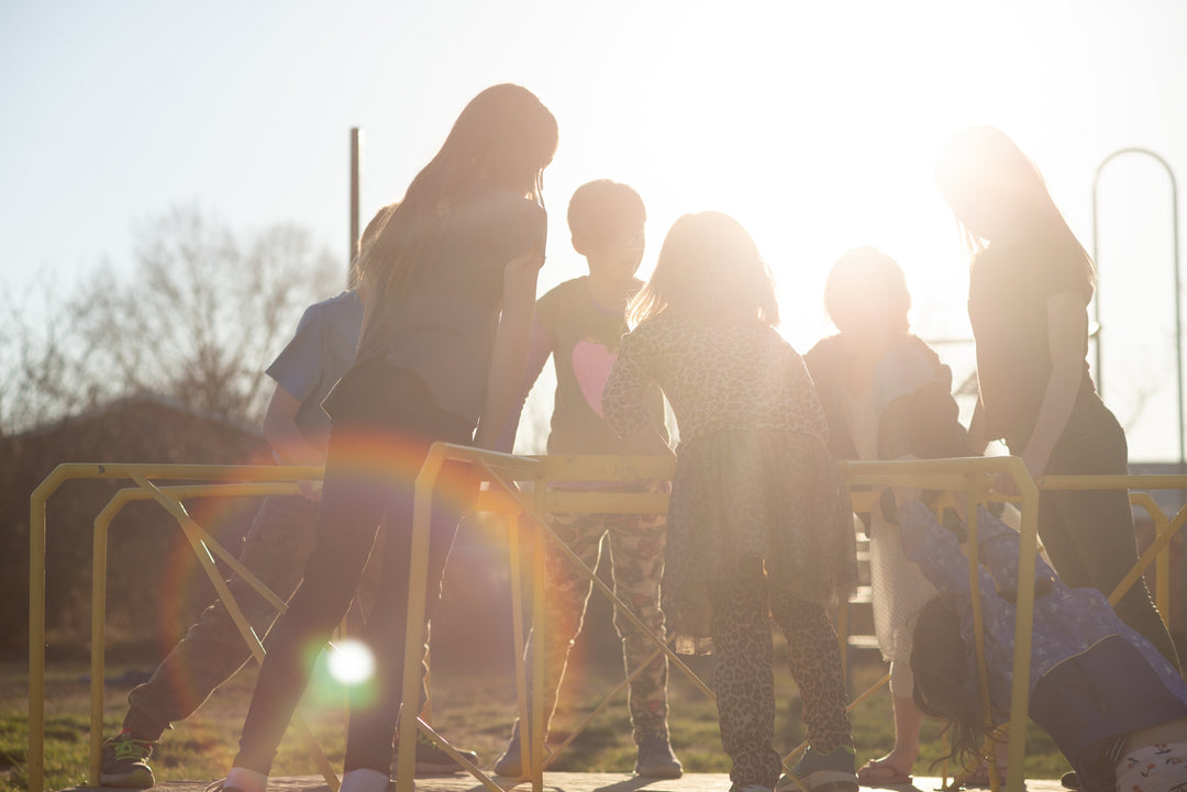 A Group Of Children Playing On A Playground In One Of The City Of Temiskaming Shores Haileybury New Liskeard Northern Ontario Community Parks Featuring Modern Play Structures Soft Rubber Surfacing & Beautiful Views Of Lake Timiskaming Having Fun